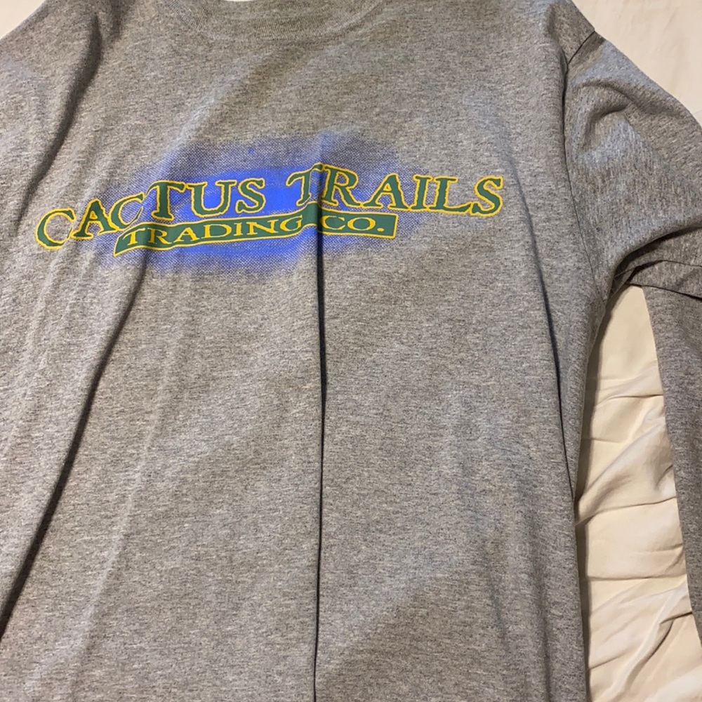 Travis Scott Trading Co. long sleeve shirt.
